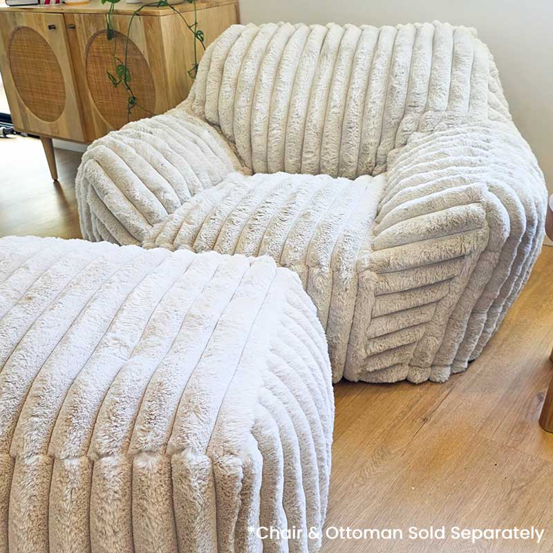 Callie Corduroy Faux Fur Armchair Foam Filled by Mooi Living paired with coordinating ottoman, styled indoors. Ottoman sold separately.