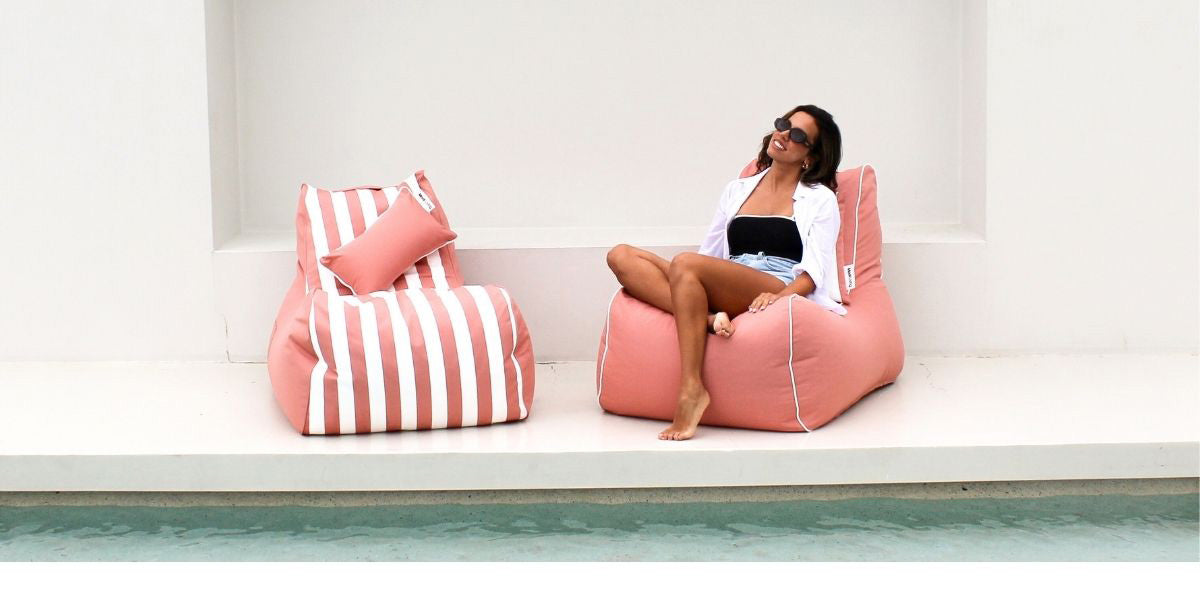 Bora Bora Bean Bag in Blush and Blush Stripe outdoor bean bag by Mooi Living with matching Cushion. This bean bag chair is a premium, weather-resistant bean bag designed for sunny patios, poolside decks, and laid-back outdoor living.
