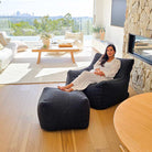 Mooi Living Black Serena bouclé indoor bean bag chair paired with matching ottoman in a modern setting.