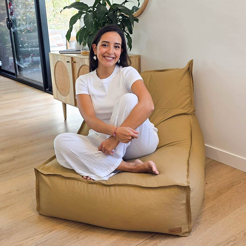 Mooi Living Tan Single Boss Bean BAg lounge-style seating positioned in a softly lit living space with model