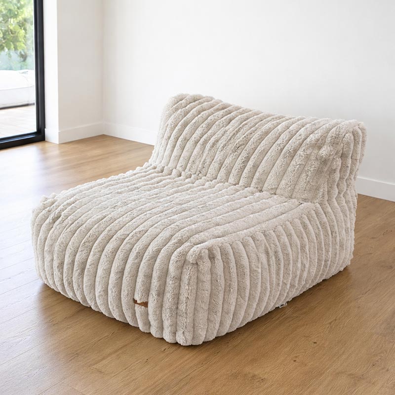 Brooklyn Luxe Lounger Foam Filled Bean Bag in Corduroy Faux Fur by Mooi Living in a neutral living room setting.