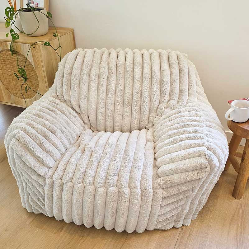 Callie Corduroy Faux Fur Armchair Foam Filled Bean Bag by Mooi Living in a neutral living room setting.