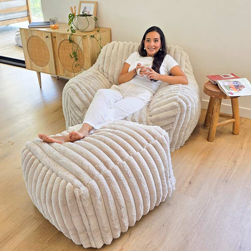 Callie Armchair and Ottoman in Corduroy Faux Fur indoor bean bag by Mooi Living in a neutral living room setting. Perfect spot to relax and suitable for any indoor space.