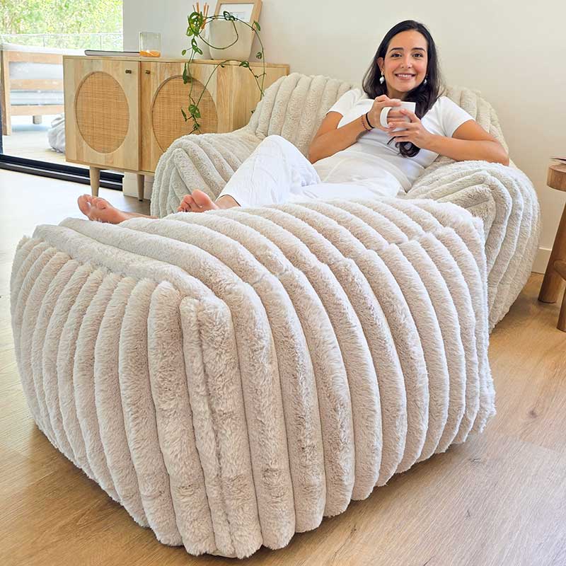Callie Armchair and Ottoman in Corduroy Faux Fur indoor bean bag by Mooi Living in a neutral living room setting. Perfect spot to relax and suitable for any indoor space.