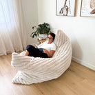 Oversized champagne Cloud Bean Bag mat indoor bean bag by Mooi Living with woman relaxing and reading indoors