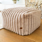 Callie Corduroy Ottoman indoor bean bag by Mooi Living in ribbed cord fabric, styled as a footrest in a modern interior.