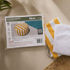 Folded Outdoor Ottoman  bean bag cover in Yellow and white Stripe and inner bag in a Mooi Living packaging.