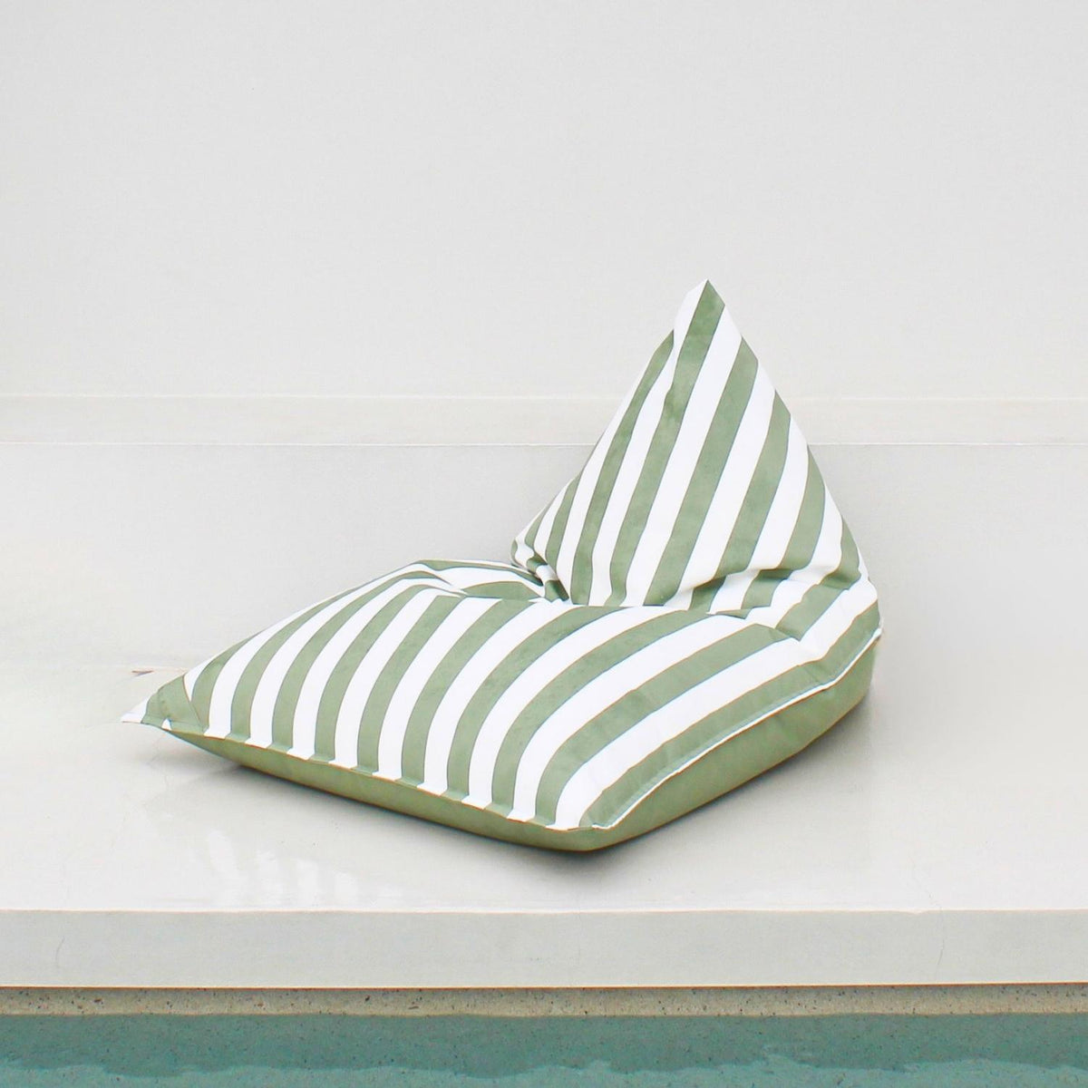 Mooi Living Sage Green reversible triangle outdoor bean bag showing its plain sage green side with striped edging, MOREVSTRIBB-GRE