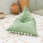 Mooi Living Sage Green reversible triangle outdoor bean bag showing its sage green and white striped side, MOREVSTRIBB-GRE