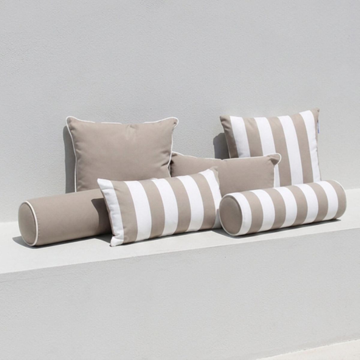 Taupe-cushion-set-on-white-bench