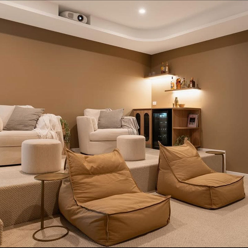 Two Tan Single Boss Bean Bags by Mooi Living placed side by side on the second-level of a media media room, customer photo by @casa.kerenjon.