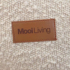 Swatch of Cream Boucle from our Serena Armchair with Mooi Living Logo.