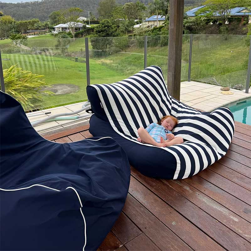 Customer Picture by Rachel Grenfell, featuring our Bora Bora in Navy and a Double Chill in Navy Stripe. Baby sleeping soundly on our bean bag.
