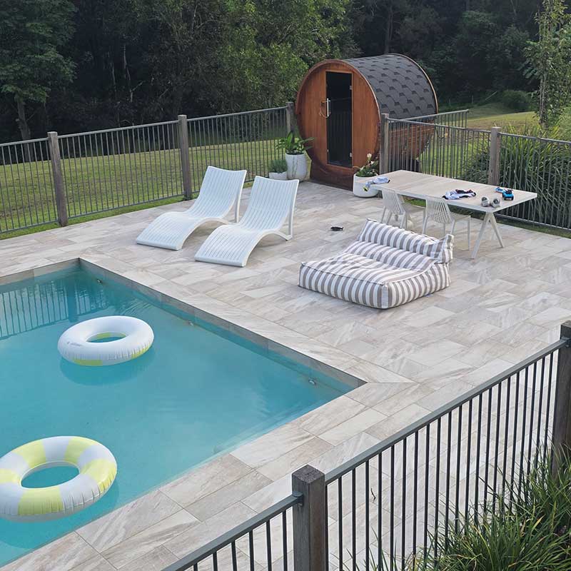 Customer pic of the Chill Lounger UV in Taupe Stripe outdoor bean bag by Mooi Living by the pool. Perfect spot for poolside relaxation