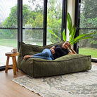 Mooi Double Cord indoor bean bag by Mooi Living in Olive Green. Dual seating in luxe cord fabric featuring three inner bags for structured support and effortless setup.