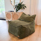 Olive green corduroy indoor bean bag by Mooi Living styled in a modern living room