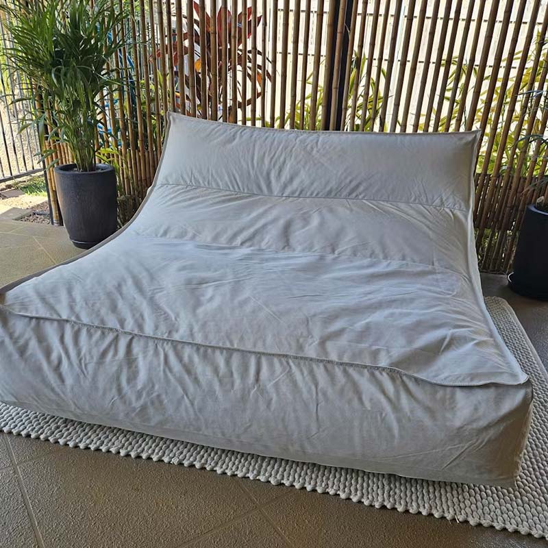 Lana Lounger Pool Float in Natural Beige. It's a double seater outdoor bean bag that delivers poolside or floating luxury.